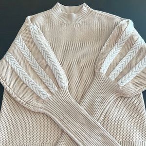 Puffy sleeves very natural color ,100% wool.